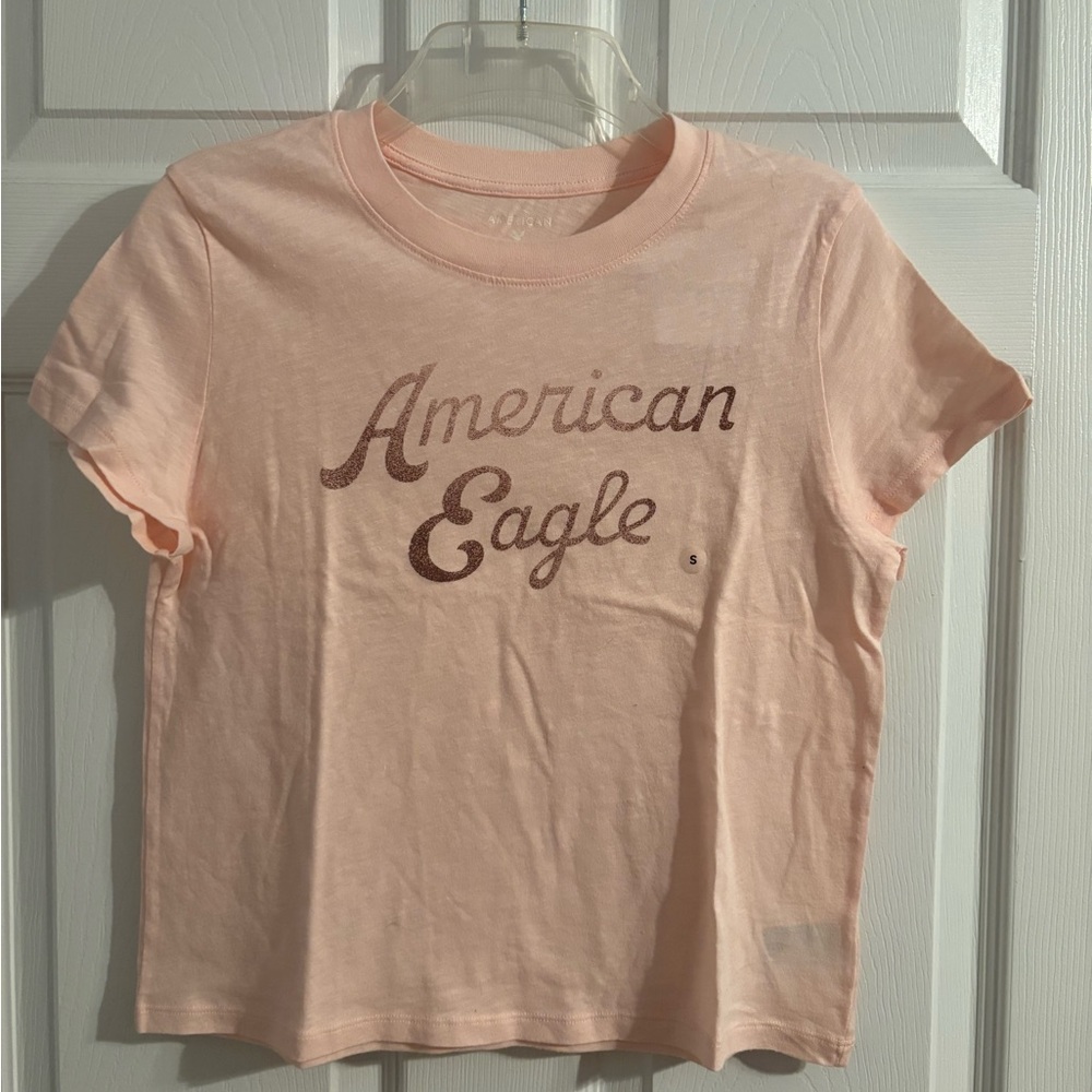 NWT American Eagle shell pink tee in small.